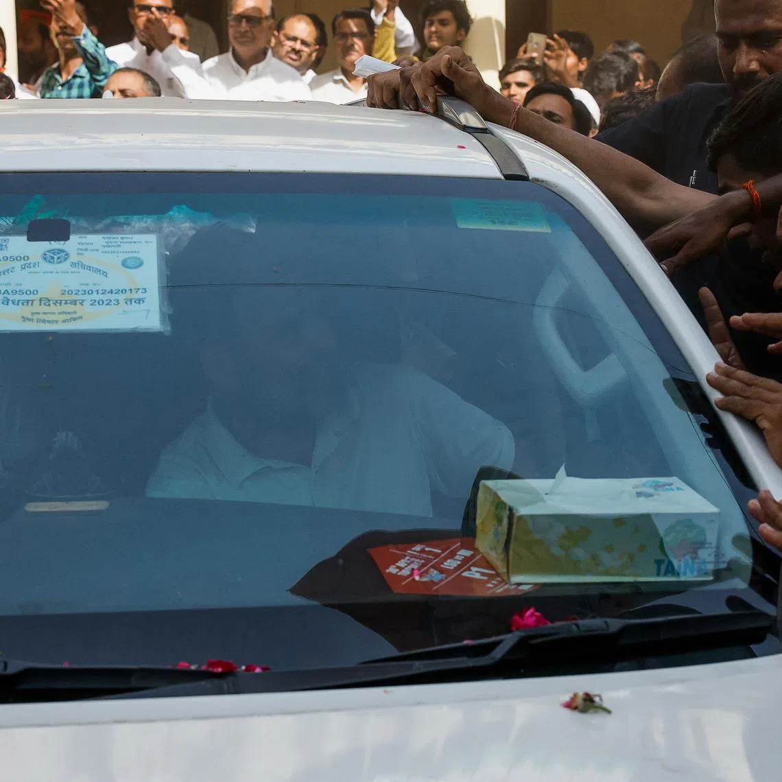 Rahul Gandhi, a senior leader of India's main opposition Congress party, looks at his supporters from a car after filing his nomination papers to contest the 2024 Lok Sabha election from the Raebareli constituency, in Raebareli, India May 3, 2024. REUTERS/Francis Mascarenhas