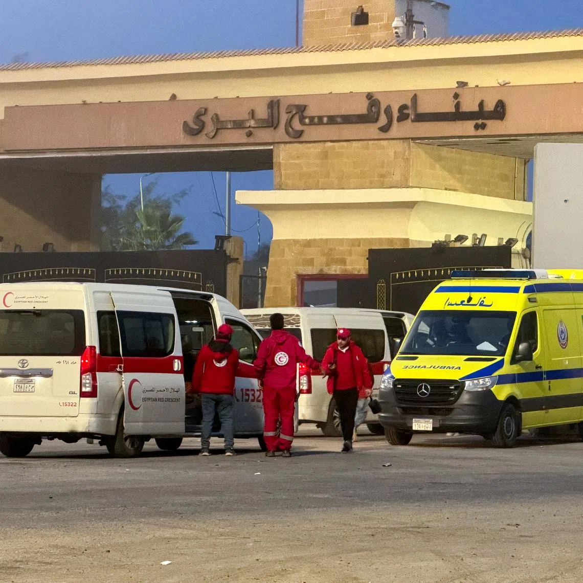 FILE PHOTO: Egyptian ambulances go through the Rafah border crossing on the Egyptian side in Rafah, Egypt, February 10, 2026. Picture taken with a mobile phone. REUTERS/Stringer/File Photo