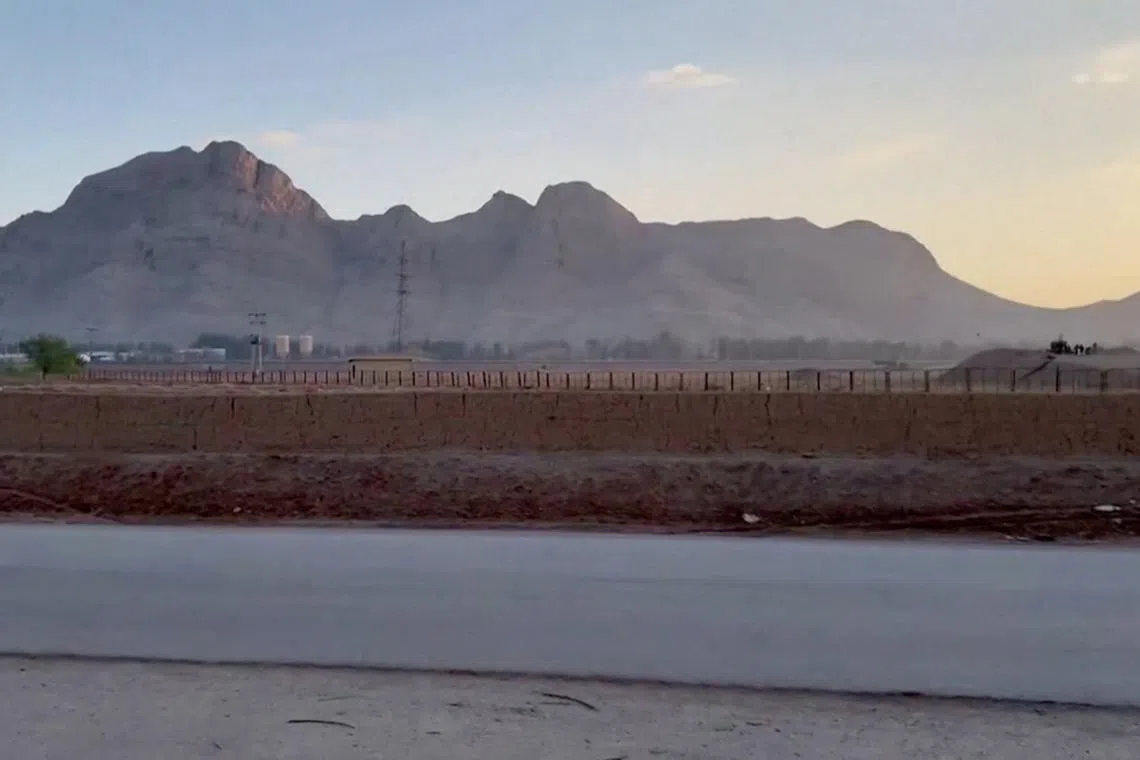 Military personnel stand guard at a nuclear facility in the Zardanjan area of Isfahan, Iran, April 19, 2024, in this screengrab taken from video.  WANA (West Asia News Agency) via REUTERS