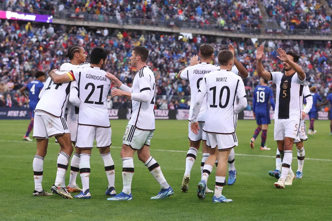 Germany's players celebrating after scoring the third goal against the US in an international friendly in East Hartford, Connecticut, on Oct 14.