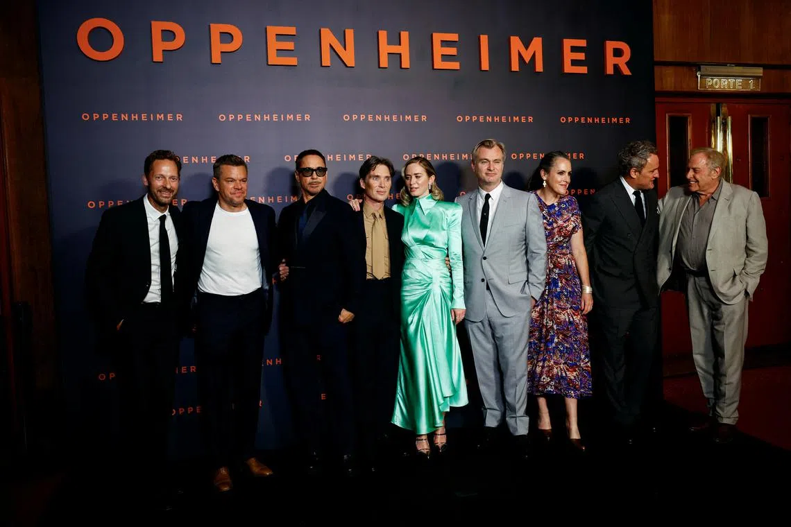 FILE PHOTO: Cast members Trond Fausa Aurvag, Matt Damon, Robert Downey Jr., Cillian Murphy, Emily Blunt, Jason Clarke, Director Christopher Nolan and his wife Emma Thomas, and Producer Charles Roven pose during a photocall before the premiere of the film \"Oppenheimer\" at the Grand Rex in Paris, France, July 11, 2023. REUTERS/Sarah Meyssonnier
