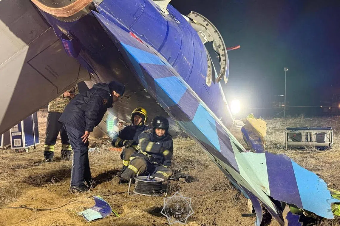 Emergency specialists work at the crash site of an Azerbaijan Airlines' Embraer passenger plane near the city of Aktau, Kazakhstan, in this picture released December 26, 2024. Kazakhstan Emergencies Ministry/Handout via REUTERS  ATTENTION EDITORS - THIS IMAGE HAS BEEN SUPPLIED BY A THIRD PARTY. NO RESALES. NO ARCHIVES. MANDATORY CREDIT. WATERMARK FROM SOURCE.