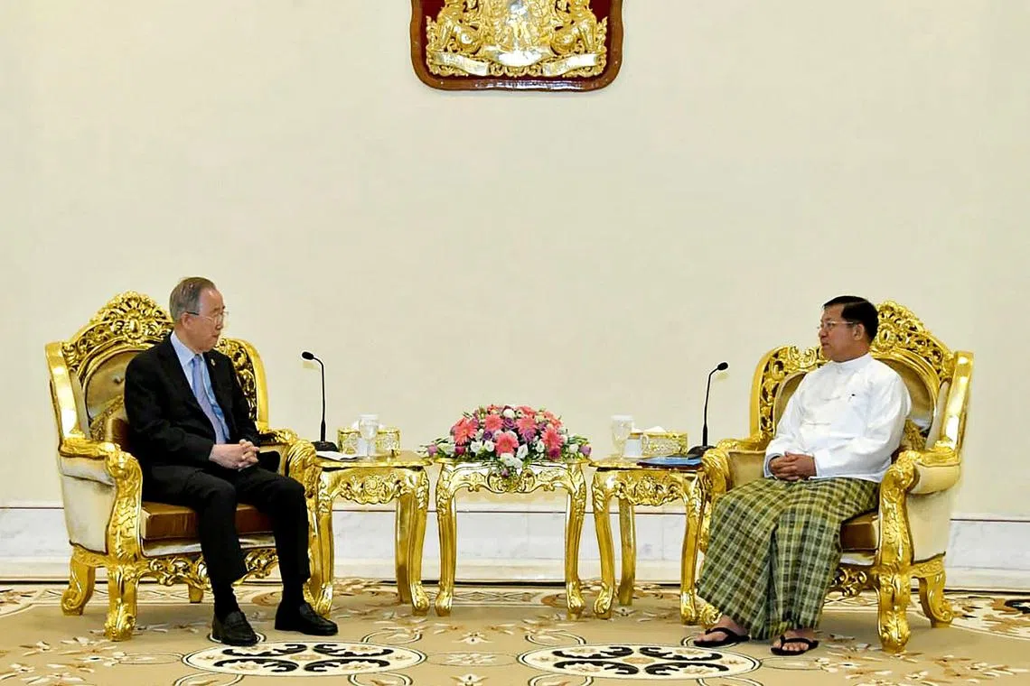 Former UN chief Ban Ki-moon (left) is seen meeting with  Myanmar junta head Min Aung Hlaing in this handout photo.