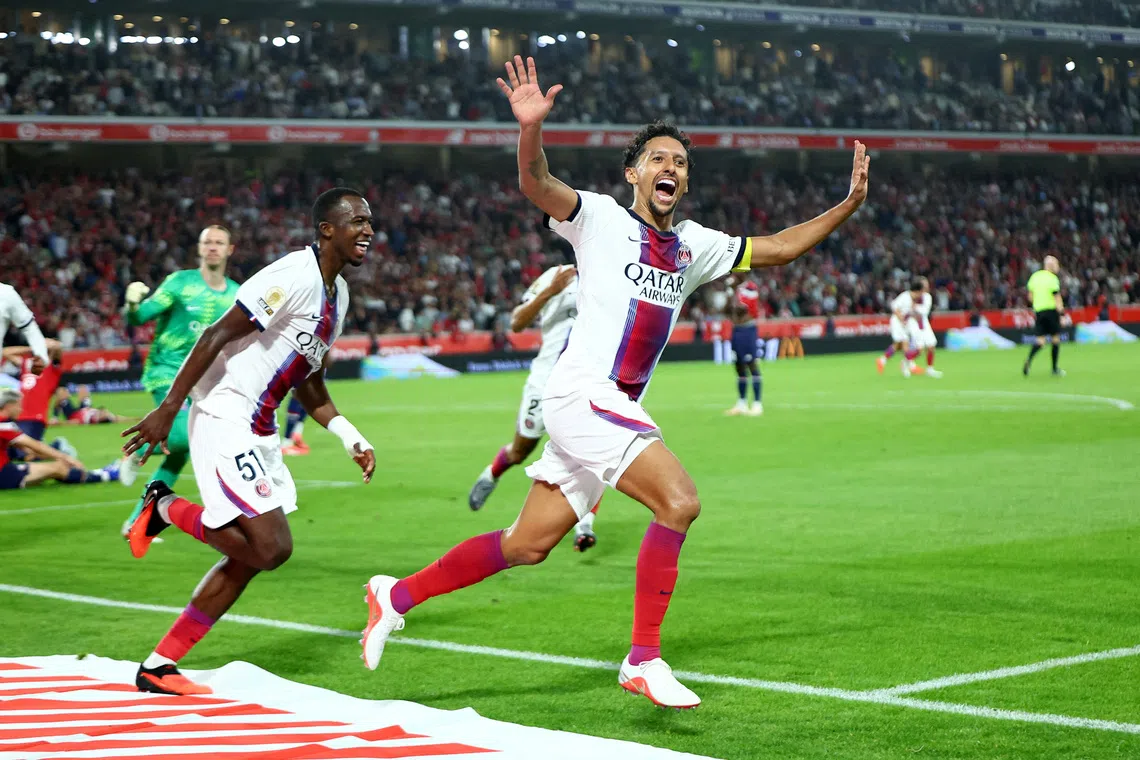 Soccer Football - Ligue 1 - Lille v Paris St Germain - Decathlon Arena Stade Pierre-Mauroy, Villeneuve d'Ascq, France - August 28, 2026 Paris St Germain's Marquinhos celebrates scoring their second goal with teammate Willian Pacho REUTERS/Abdul Saboor     TPX IMAGES OF THE DAY