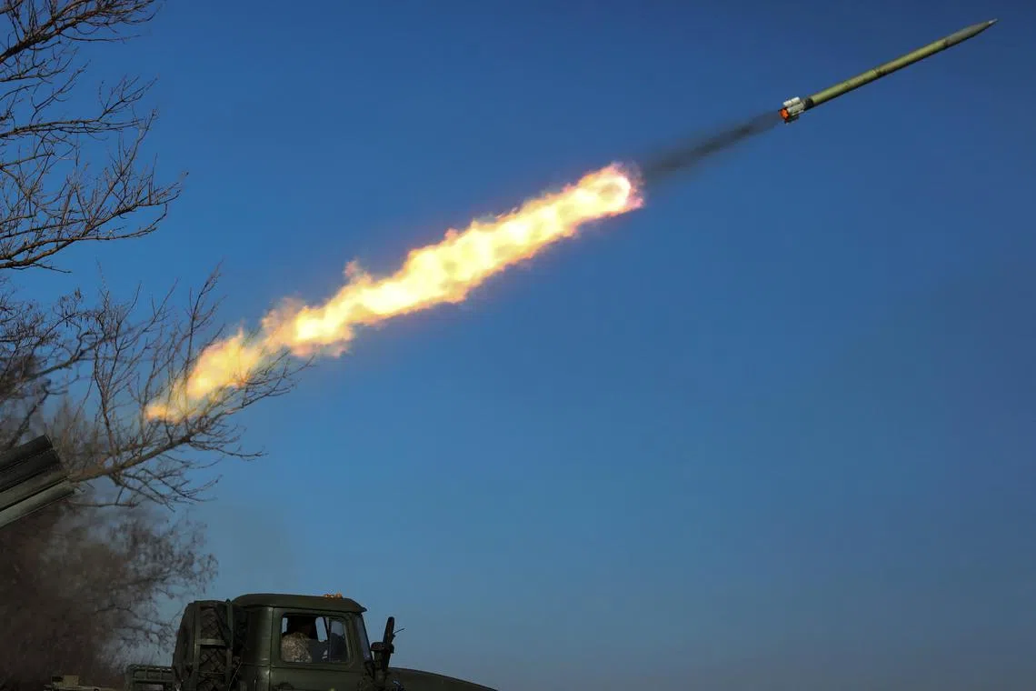 Ukrainian servicemen fire a BM-21 Grad multiple launch rocket system towards Russian troops in the Donetsk region.