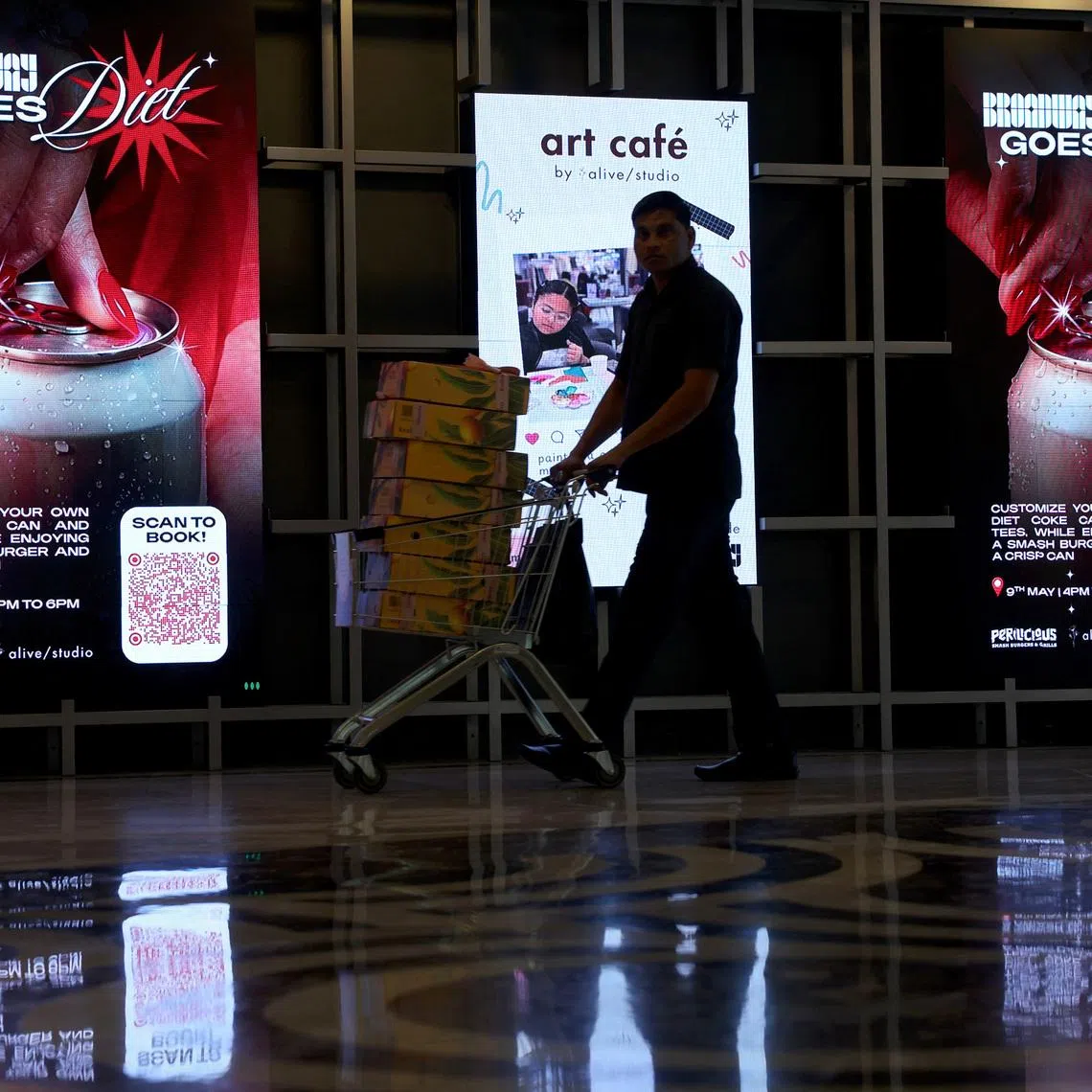 Screens displaying advertisements for an upcoming "Diet Coke party" in New Delhi, India, on May 5, amid an aluminium can shortage caused by the closure of the Strait of Hormuz.