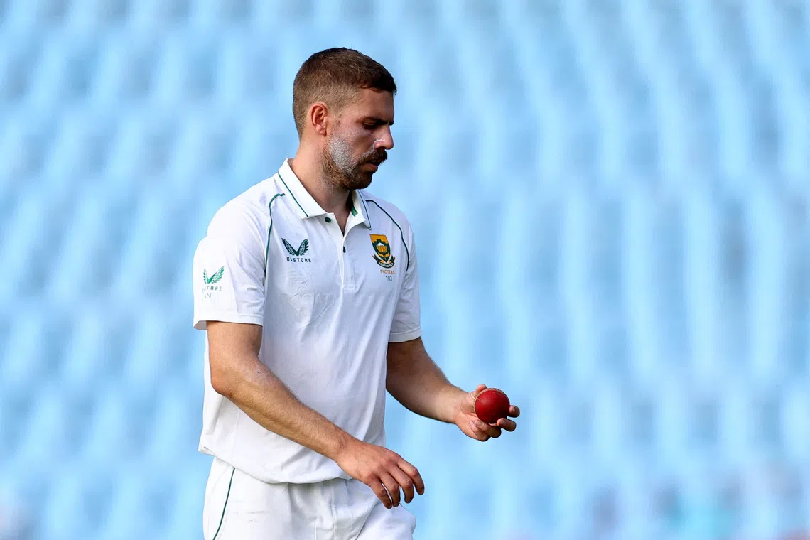 Cricket - First Test - South Africa v West Indies - SuperSport Park Cricket Stadium, Centurion, South Africa - March 1, 2023 South Africa's Anrich Nortje looks at the ball before bowling REUTERS/Siphiwe Sibeko/File Photo