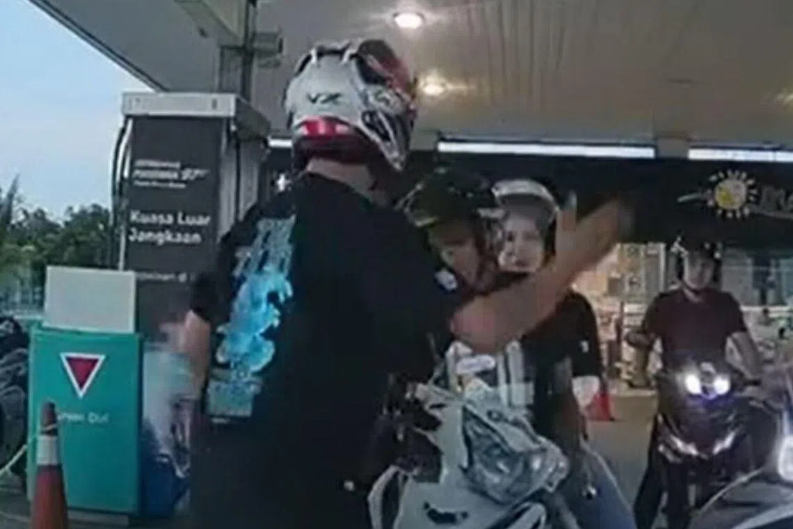 Malaysia cop filmed slapping motorcyclist at JB petrol kiosk pulled from operations