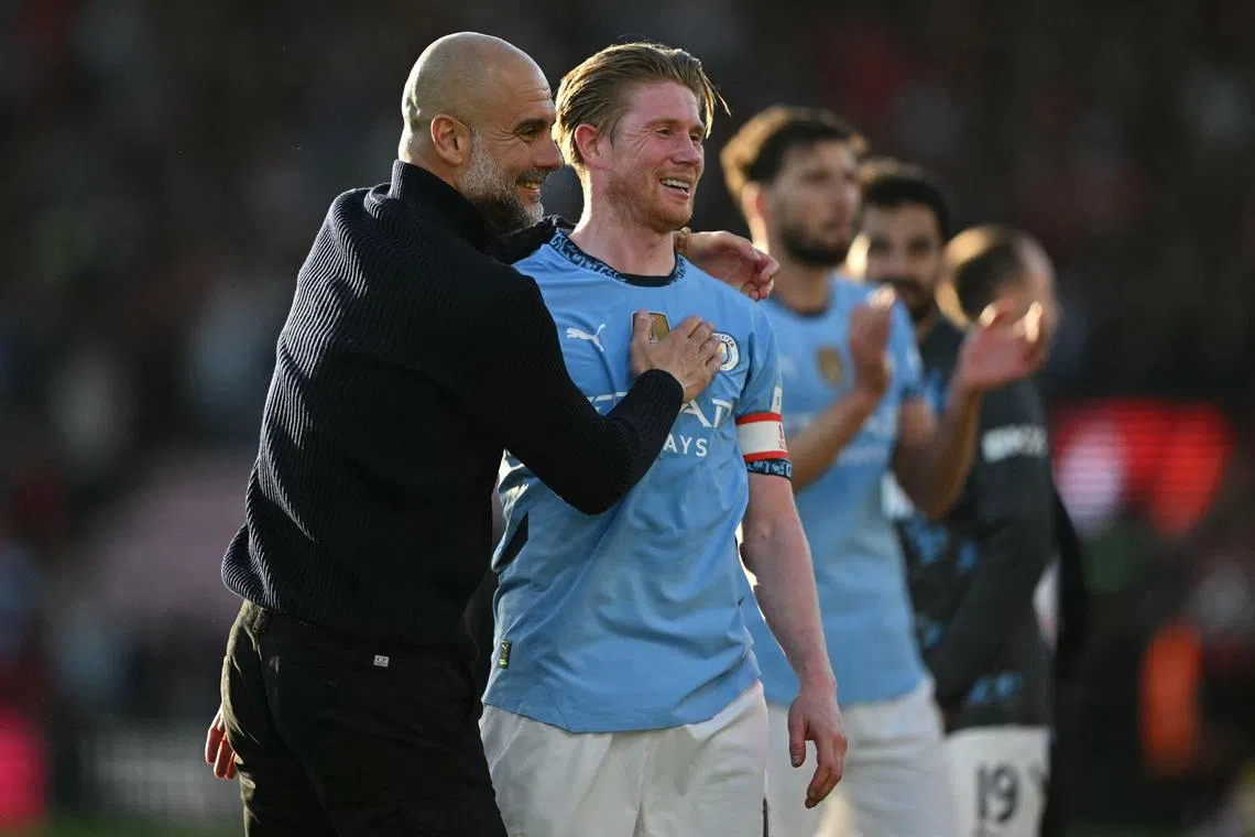 (FILES) Manchester City's Spanish manager Pep Guardiola (L) celebrates with Manchester City's Belgian midfielder #17 Kevin De Bruyne (R) after the English FA Cup quarter-final football match between Bournemouth and Manchester City at the Vitality Stadium in Bournemouth, on the south coast of England on March 30, 2025. Manchester City midfielder Kevin De Bruyne confirmed on Friday, April 4, that he will leave the club at the end of the season. (Photo by JUSTIN TALLIS / AFP) / RESTRICTED TO EDITORIAL USE. No use with unauthorized audio, video, data, fixture lists, club/league logos or 'live' services. Online in-match use limited to 120 images. An additional 40 images may be used in extra time. No video emulation. Social media in-match use limited to 120 images. An additional 40 images may be used in extra time. No use in betting publications, games or single club/league/player publications. / 
