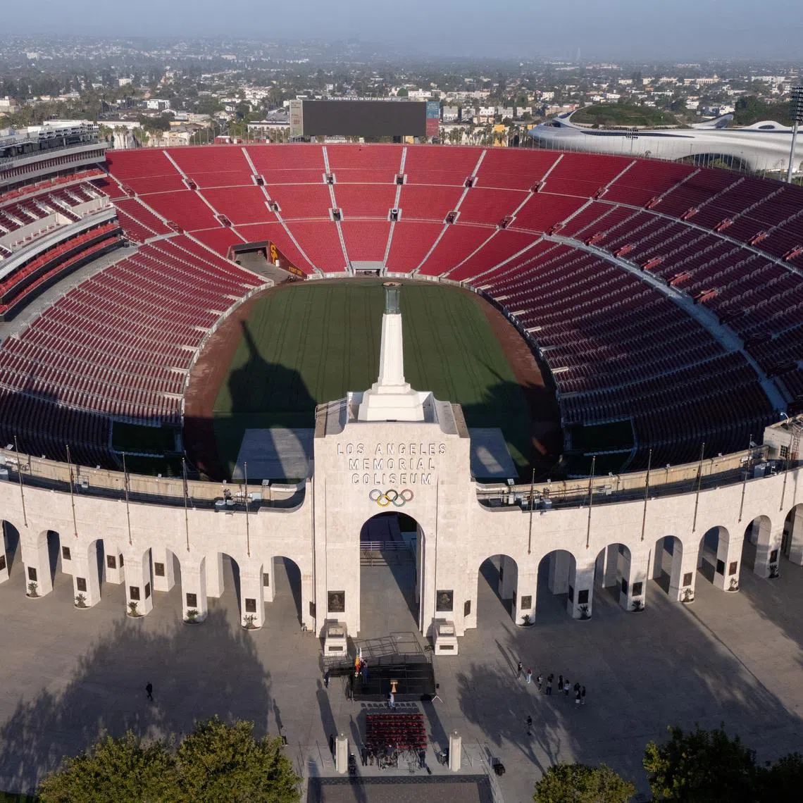 FILE PHOTO: A drone view of Los Angeles Coliseum, as it was announced it will host the opening ceremonies of the 2028 Olympics along with SoFi Stadium in a dual event, closing ceremony, and host the opening of the Paralympic Games in 2028, making it the first facility to host events for 3 Olympic Games in Los Angeles, California, U.S., May 8, 2025. REUTERS/Mike Blake/File Photo