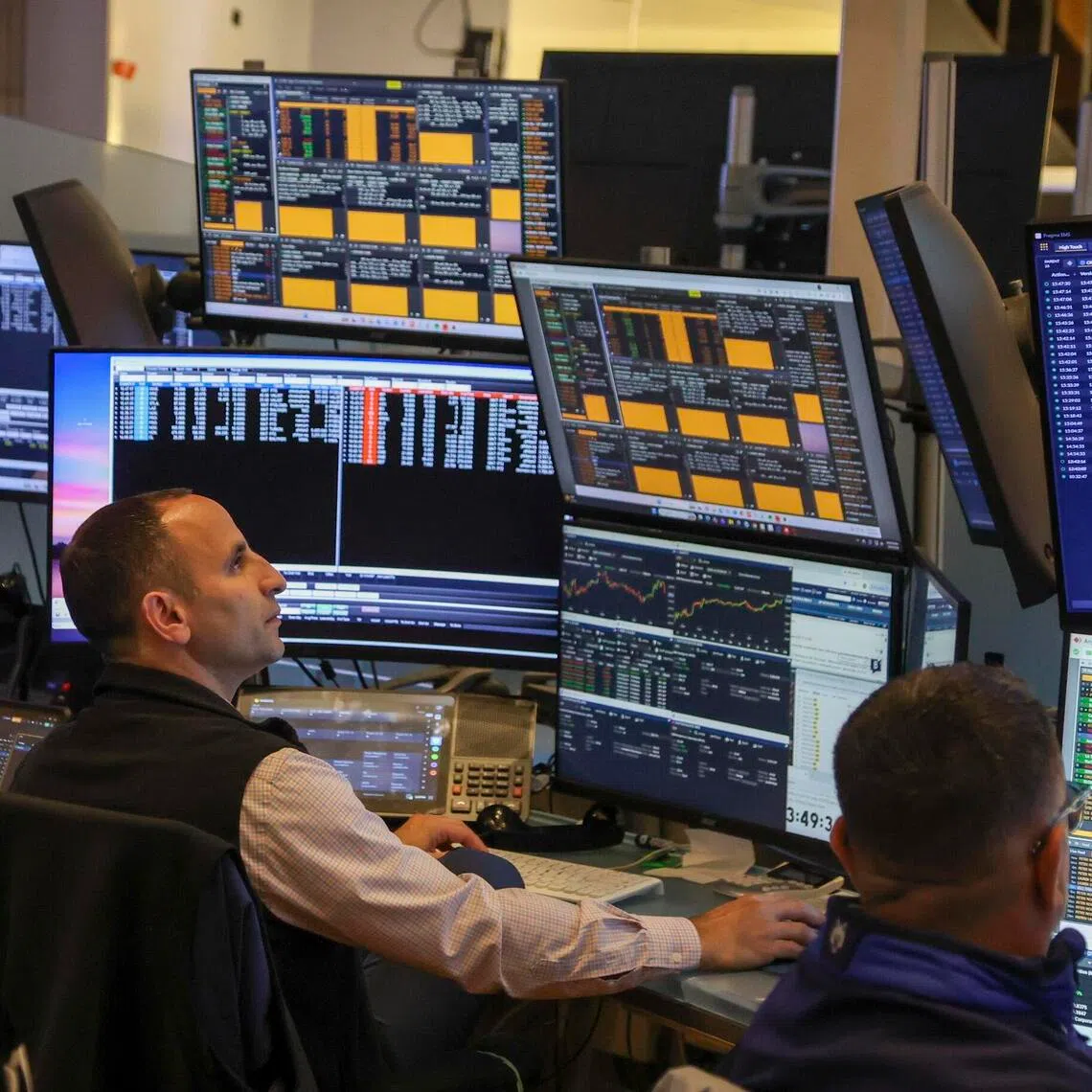 Traders working on the floor of the New York Stock Exchange on Oct 6, in New York City.