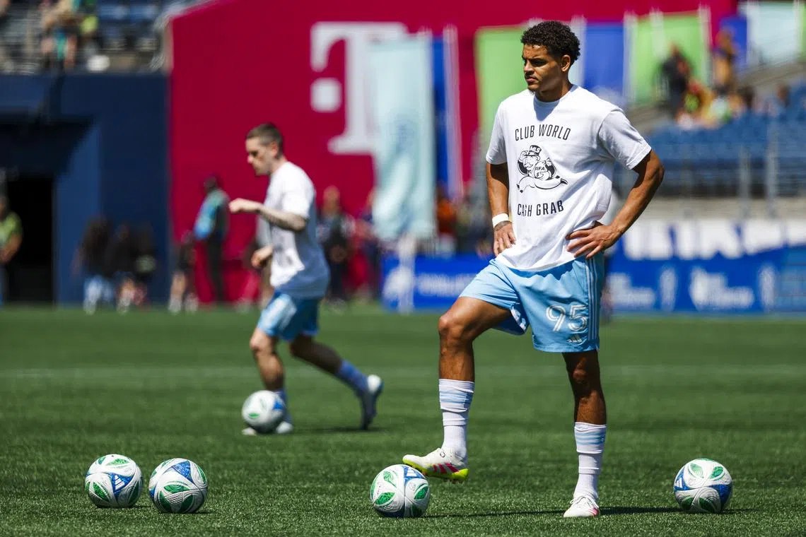 Jun 1, 2025; Seattle, Washington, USA; Seattle Sounders FC forward Osaze De Rosario (95) wears a t-shirt to protest FIFA Club World Cup bonus sharing from MLS while participating in pregame warmups against the Minnesota United at Lumen Field. Mandatory Credit: Joe Nicholson-Imagn Images