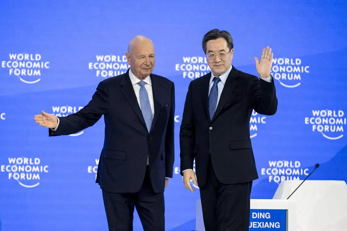 World Economic Forum founder and chairman Klaus Schwab (left) and Chinese Vice-Premier Ding Xuexiang onstage at the World Economic Forum meeting in Davos, on Jan 21.