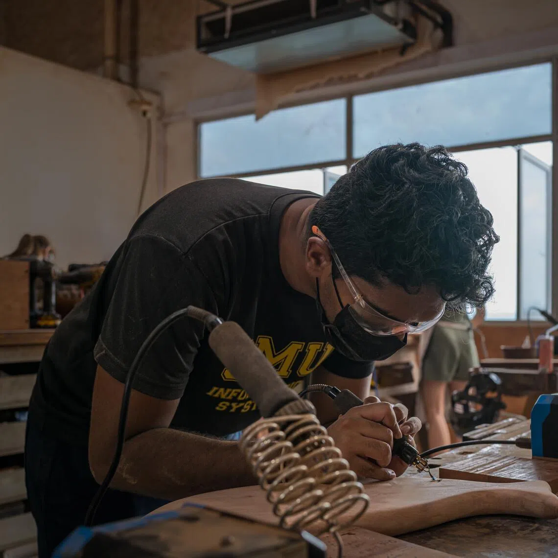 The author, Santos, went to a cheeseboard making class at Tombalek, a beautiful local woodcraft studio. 