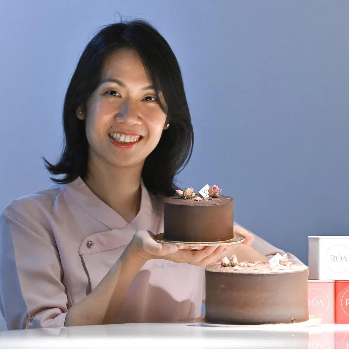 ROA founder Jane Tan with the vegan and allergen-free cake that started it all, the Midnight Cake.