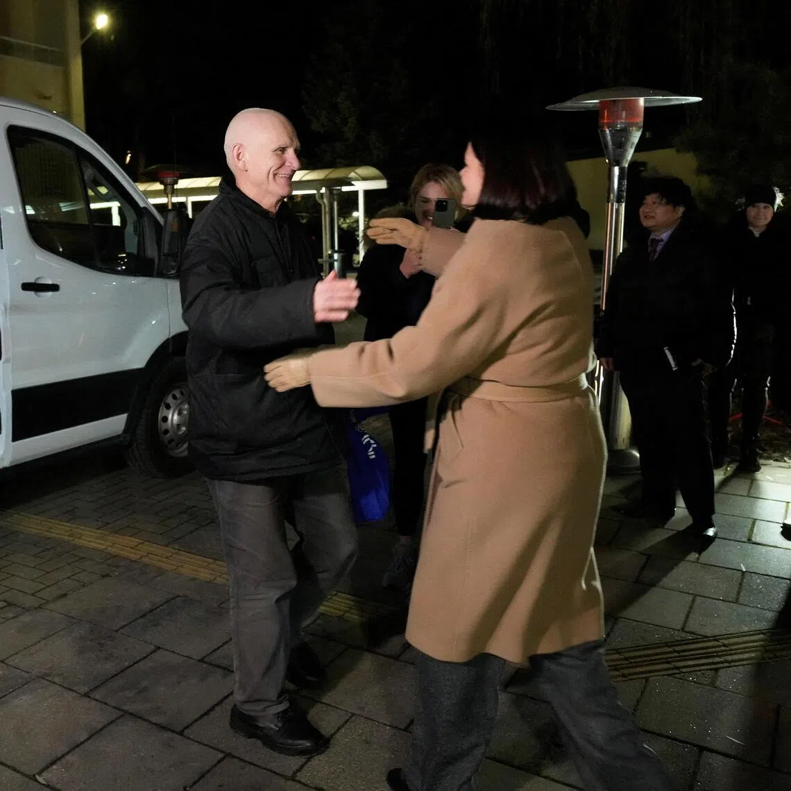 Belarusian opposition leader Sviatlana Tsikhanouskaya (right) greeting Nobel Peace Prize winner Ales Bialiatski in Lithuania, on Dec 13, after he was freed by Belarus.
