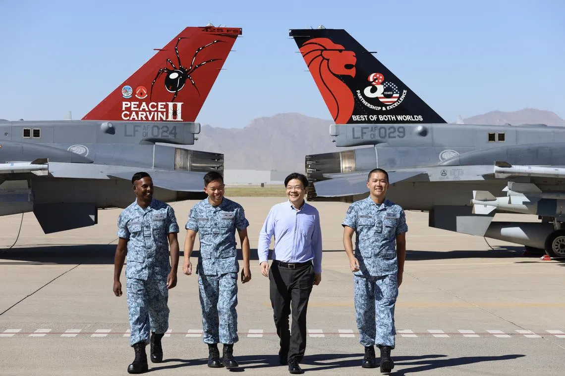DPM Wong (third from left) viewed a static display of the RSAF’s F-16 fighter aircraft during his visit.