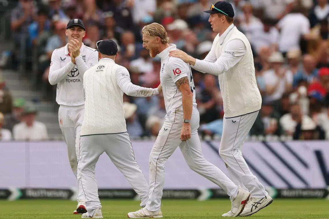 FILE PHOTO: Cricket - International Test Match Series - Fourth Test - England v India - Old Trafford Cricket Ground, Manchester, Britain - July 23, 2025 England's Ben Stokes celebrates with teammates after taking the wicket of India's Sai Sudharsan Action Images via Reuters/Lee Smith/File Photo