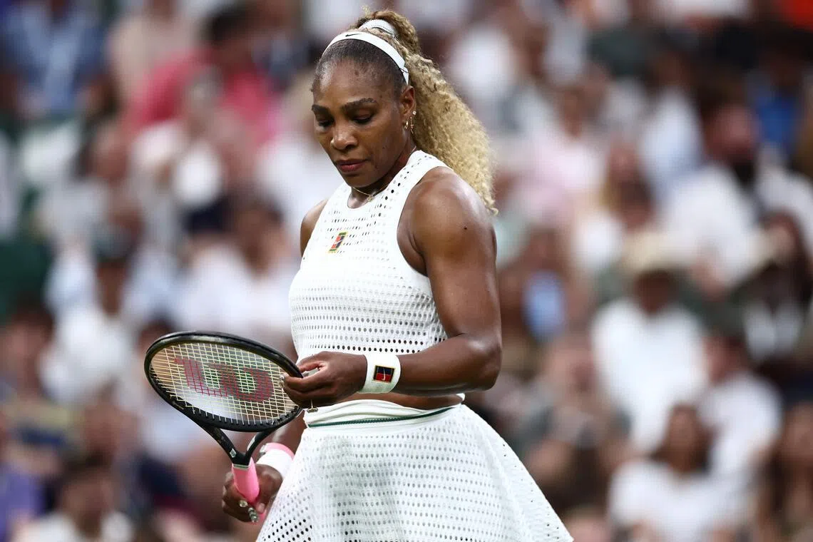 TOPSHOT - US player Serena Williams reacts as she plays against Australia's Maya Joint during their women's singles first round tennis match on the second day of the 2026 Wimbledon Championships at The All England Lawn Tennis and Croquet Club in Wimbledon, southwest London, on June 30, 2026. (Photo by HENRY NICHOLLS / AFP) / RESTRICTED TO EDITORIAL USE