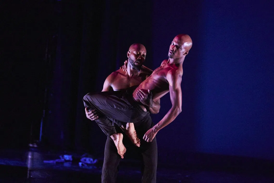 Dancers Dedrick “D. Banks” Gray (background) and Timothy “Solomon” Bowser (foreground) perform a duet unpacking masculinity through the lenses of two black men.