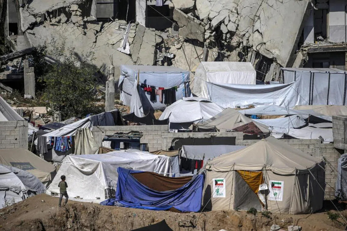 epa12075548 A child walks next to tents of internally displaced Palestinians, who fled from northern Gaza Strip and east of Gaza City, set up around Al Yarmouk stadium in central Gaza City, the Gaza Strip, 05 May 2025. According to the UN, at least 1.9 million people (or nine in ten people) across the Gaza Strip are internally displaced, including people who have been repeatedly displaced. Since October 2023, only about 11 percent of the Gaza Strip has not been placed under Israeli-issued evacuation orders, the UN aid coordination office OCHA said. EPA-EFE/MOHAMMED SABER