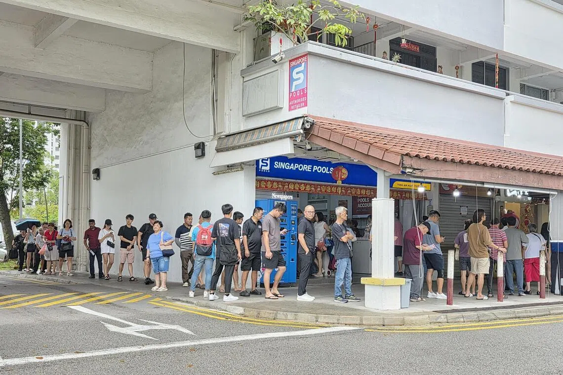 Queues had formed at Singapore Pools outlets islandwide ahead of the draw at 9.30pm on Feb 27.