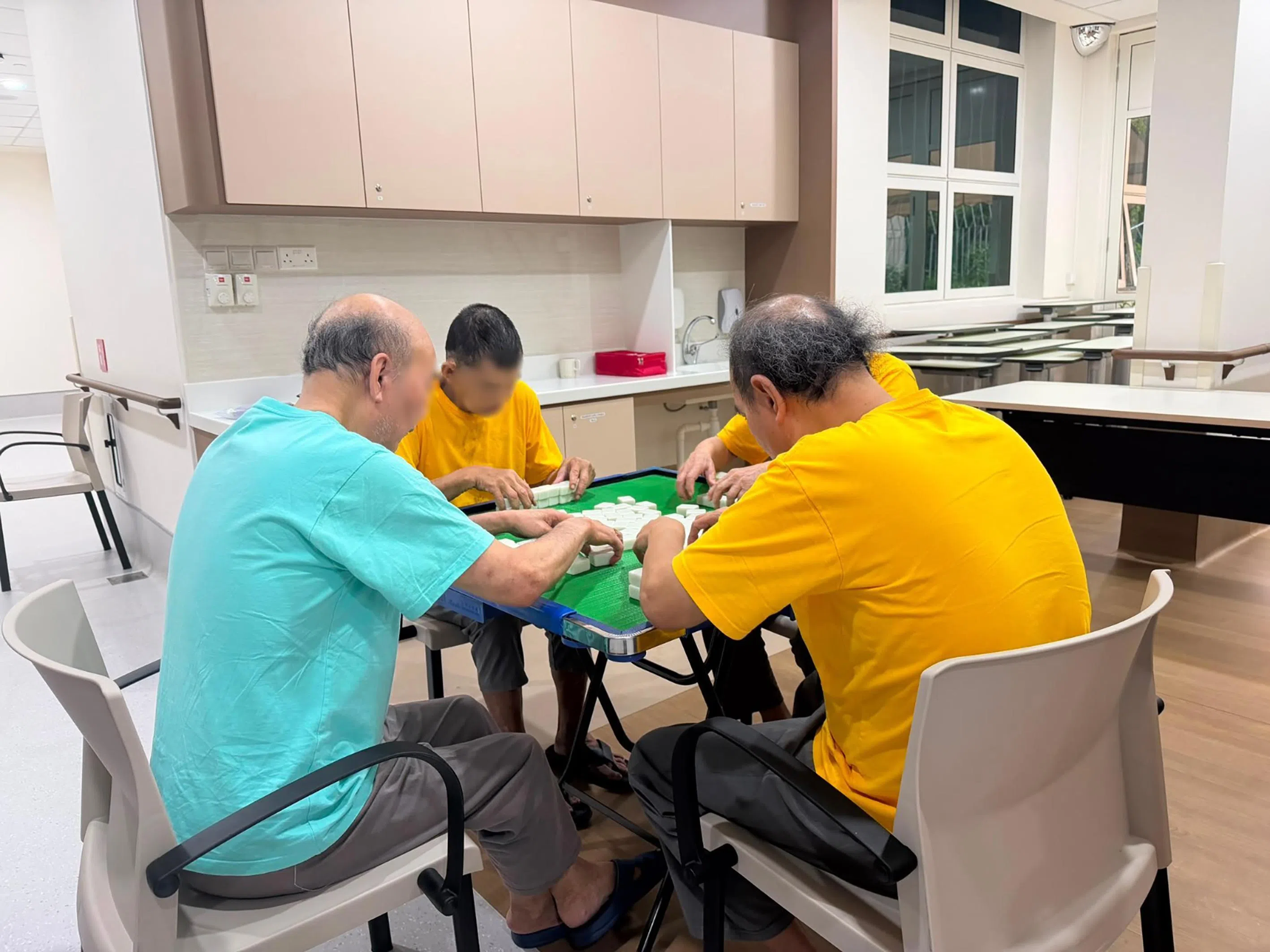 Residents playing mahjong at Vanguard Care Home (Hougang), a newly opened psychiatric nursing home.