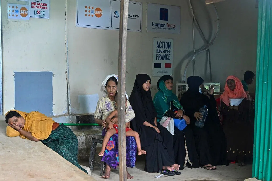 Rohingya refugees wait to receive treatment at a maternity ward in Kutupalong refugee camp in Ukhia, Bangladesh.