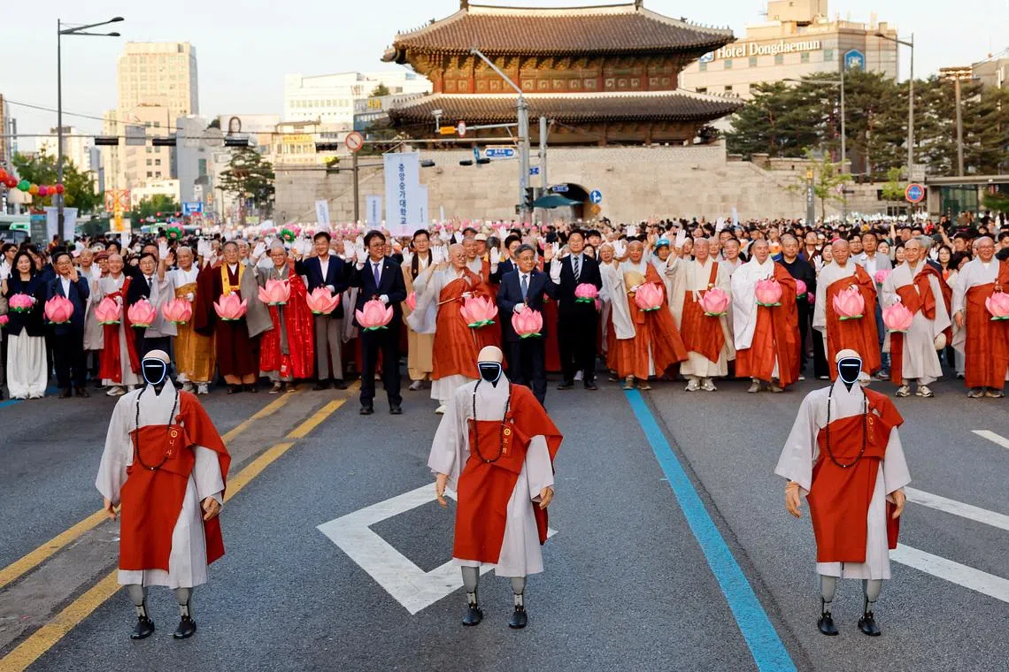 Robots dressed up in monk robes including Buddist monks holding Lotus Lanterns, during the Lotus Lantern parade ahead of Buddha’s birthday in Seoul, South Korea on May 16, 2026. 