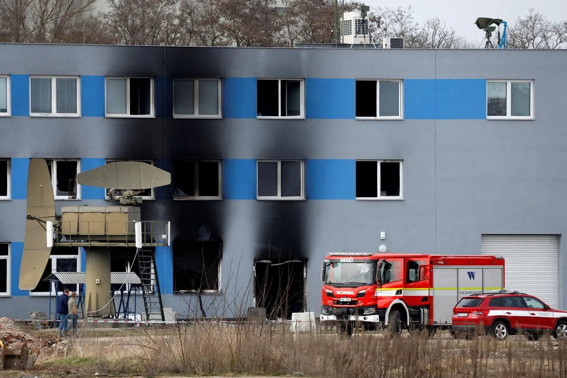 FILE PHOTO: A firetruck stands in front of a burned production hall at an industrial area in Pardubice, Czech Republic, March 20, 2026. REUTERS/David W Cerny/File Photo