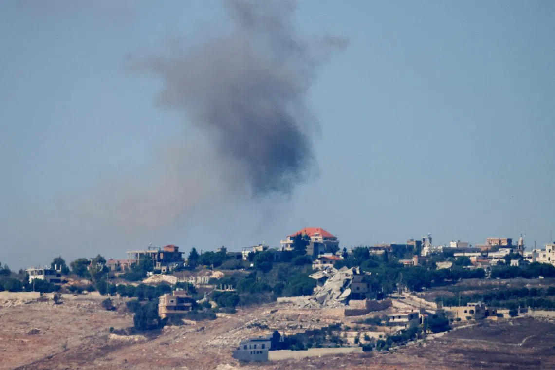 Smoke billows after Israeli Air Force air strikes in southern Lebanon villages, amid cross-border hostilities between Hezbollah and Israel, as seen from northern Israel, September 30, 2024. REUTERS/Jim Urquhart