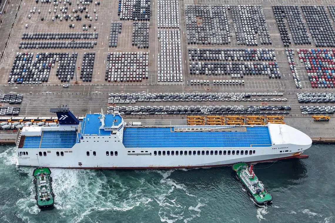 Cars for export waiting to be loaded onto a ship are seen at a port in Yantai, in eastern China's Shandong province on June 29, 2025. 