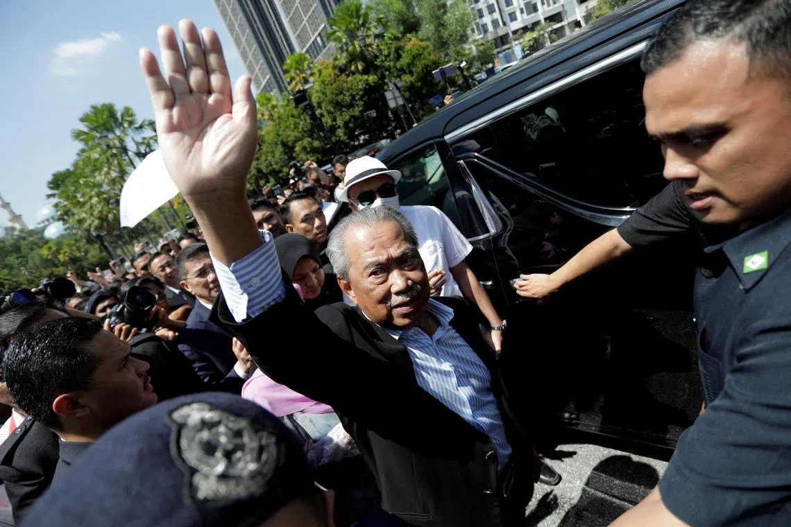 Former Malaysian Prime Minister Muhyiddin Yassin waves outside Kuala Lumpur Court Complex in Kuala Lumpur, Malaysia March 10, 2023. REUTERS/Hasnoor Hussain     TPX IMAGES OF THE DAY     