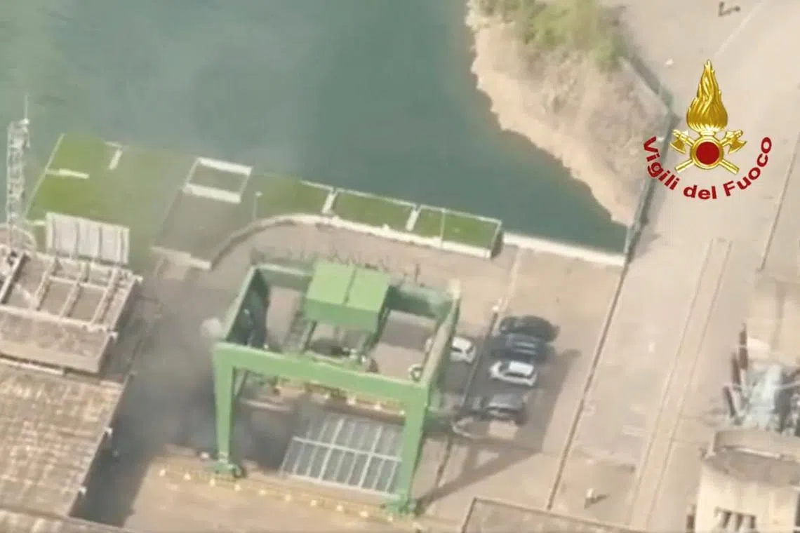 Smoke rises after a blast at a hydroelectric power plant in Bargi, Italy, April 9, 2024, in this screen grab taken from video. Vigili del Fuoco/Handout via REUTERS