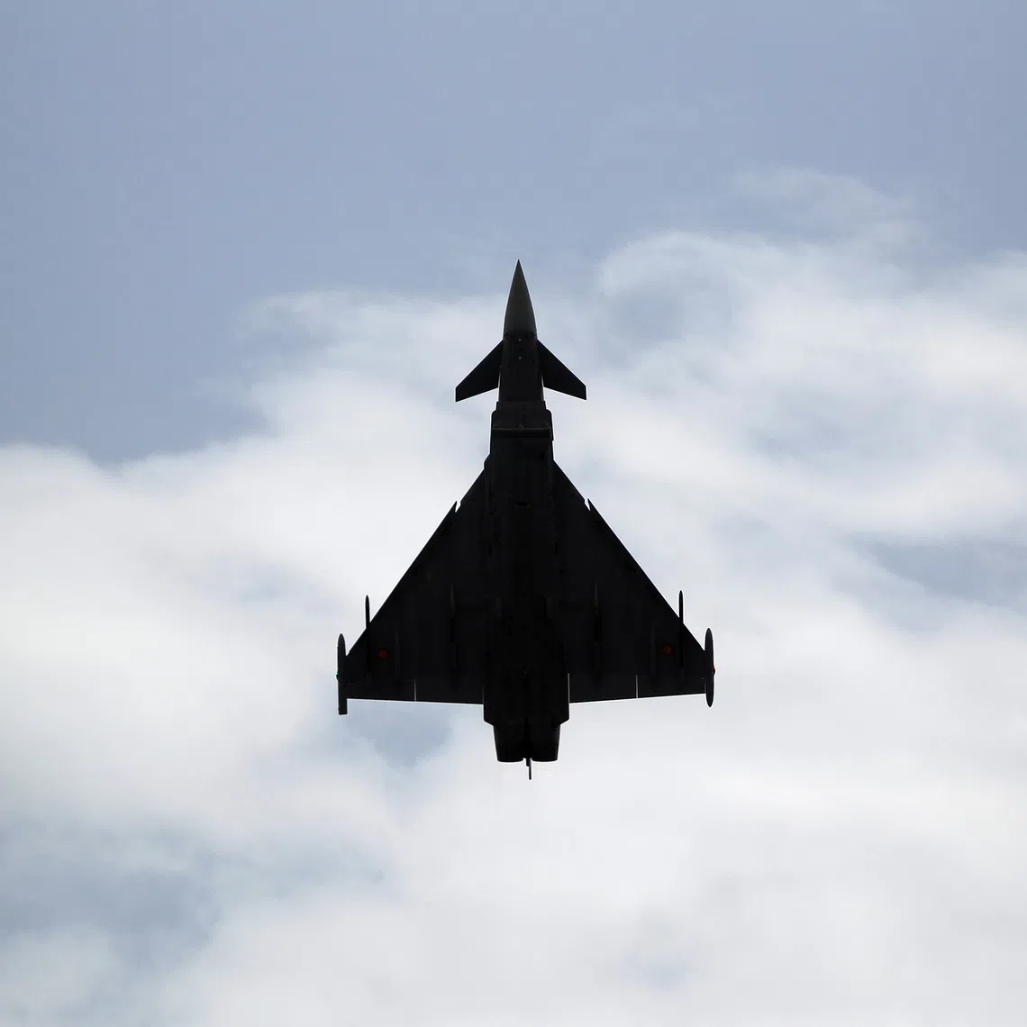 A Eurofighter Typhoon fighter jet flies vertically over a beach during an airshow in Torre del Mar, southern Spain, July 31, 2016. REUTERS/Jon Nazca