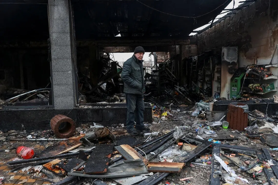 A resident stands at the site of a Russian drone strike, amid Russia's attack on Ukraine, in Odesa, Ukraine, February 17, 2026. REUTERS/Nina Liashonok