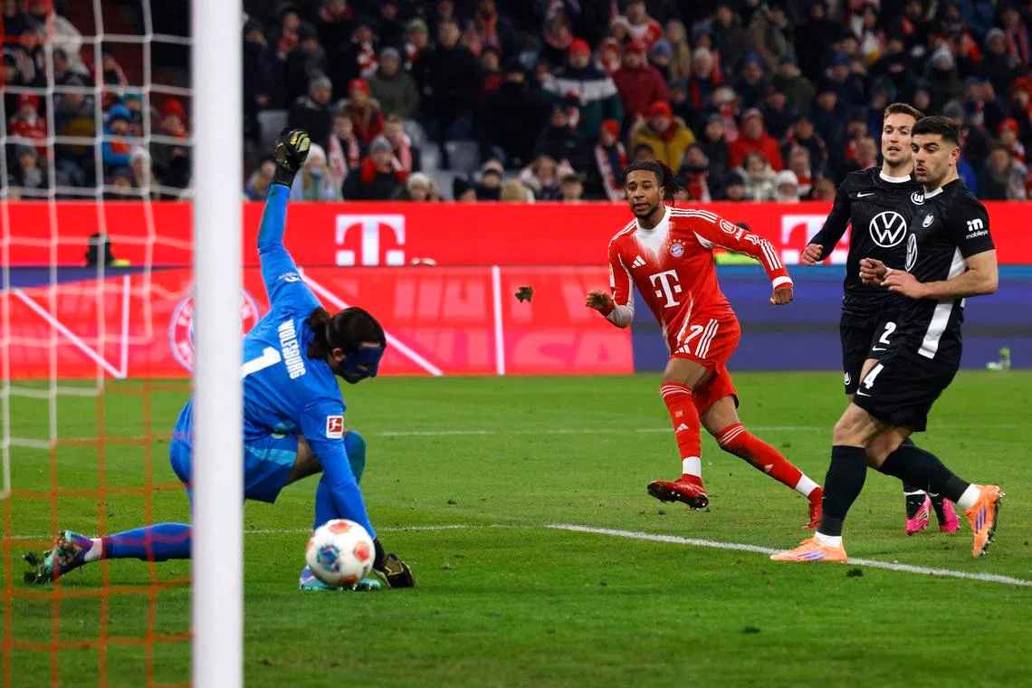 Soccer Football - Bundesliga - Bayern Munich v VfL Wolfsburg - Allianz Arena, Munich, Germany - January 11, 2026  Bayern Munich's Michael Olise scores their seventh goal REUTERS/Michaela Stache