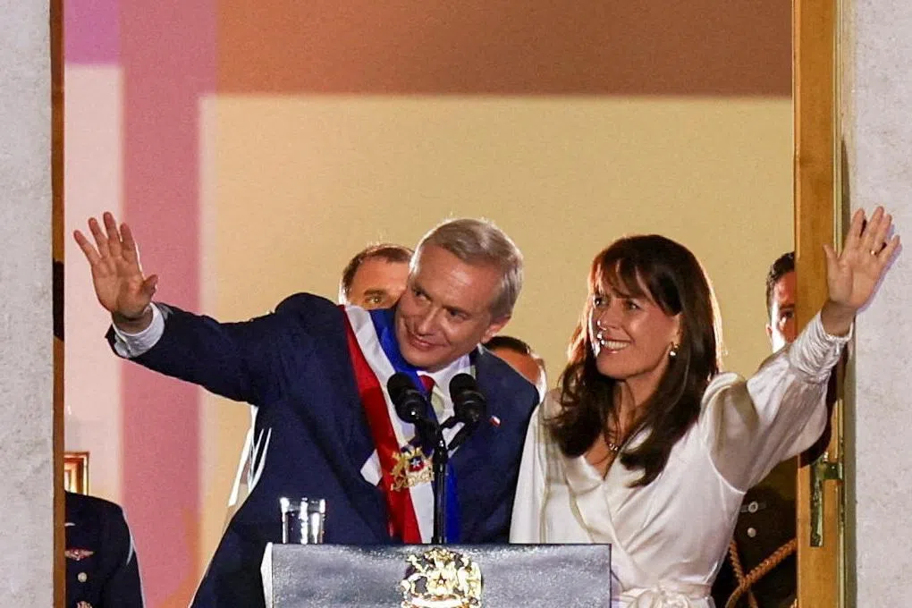 Chile's President Jose Antonio Kast and his wife Maria Pia Adriasola wave from the La Moneda presidential palace, following his swearing in ceremony, in Santiago, Chile, March 11, 2026. REUTERS/Pablo Sanhueza