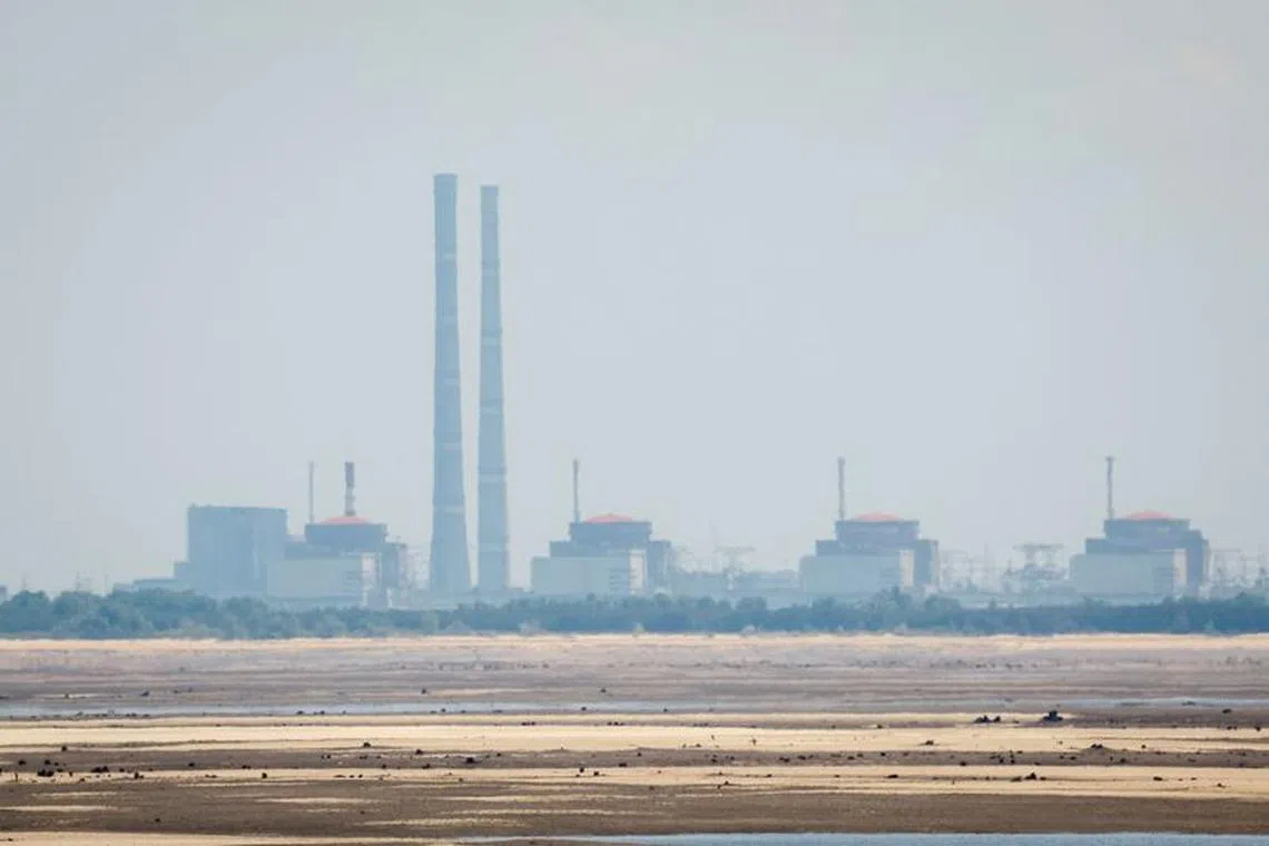 FILE PHOTO: A view shows Zaporizhzhia Nuclear Power Plant from the bank of Kakhovka Reservoir near the town of Nikopol after the Nova Kakhovka dam breached, amid Russia's attack on Ukraine, in Dnipropetrovsk region, Ukraine June 16, 2023. REUTERS/Alina Smutko/File Photo
