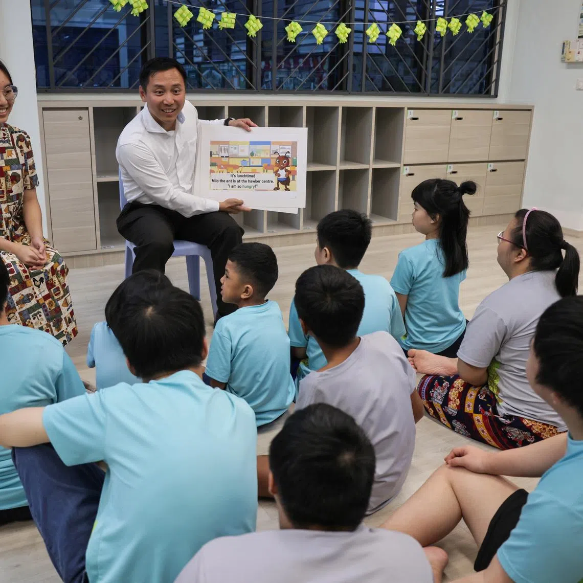 Minister of State for Social and Family Development Goh Pei Ming (right) joins students of MINDS Woodlands Gardens School for part of a storytelling session on March 25.