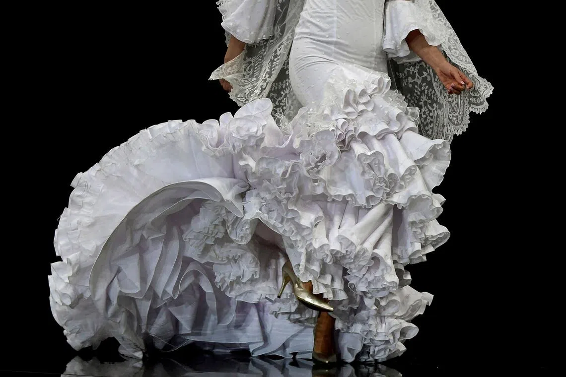 A model presents a creation by Maricruz Montecarlo during the Simof 2023 (International Flamenco Fashion Show) in Sevilla on Jan 29, 2023. 