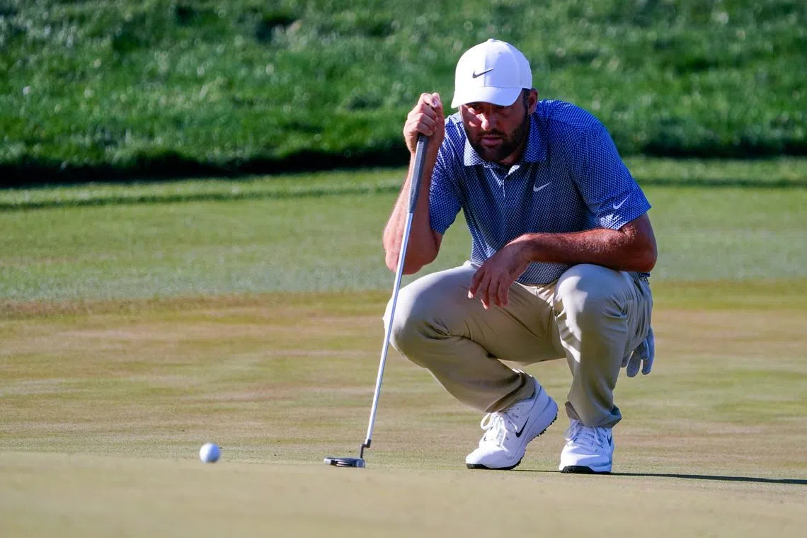 Mar 13, 2026; Ponte Vedra Beach, Florida, USA; Scottie Scheffler lines up his putt on the 14th green during the second round of THE PLAYERS Championship golf tournament. Mandatory Credit: Jeff Romance-Imagn Images