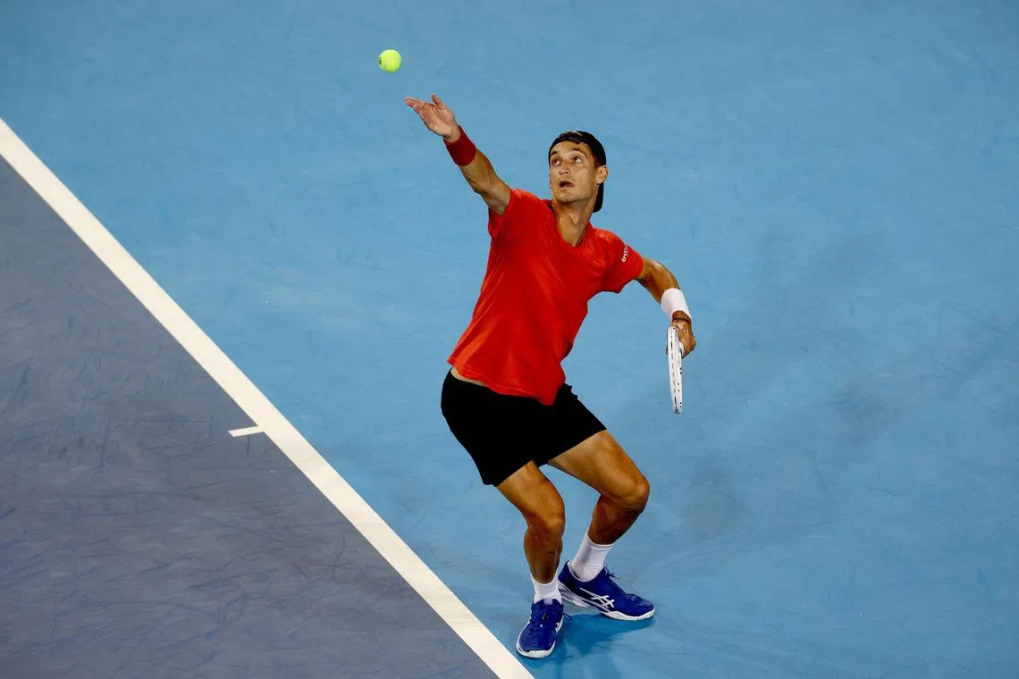 Terence Atmane of France serves to Holger Rune of Denmark during the Cincinnati Open.