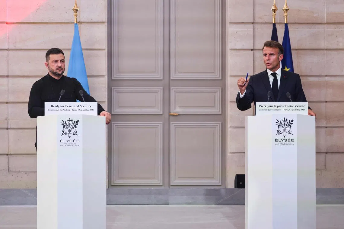 Ukrainian President Volodymyr Zelensky (left) and French President Emmanuel Macron attending a Paris press conference after a meeting of the "coalition of the willing" on Sept 4.