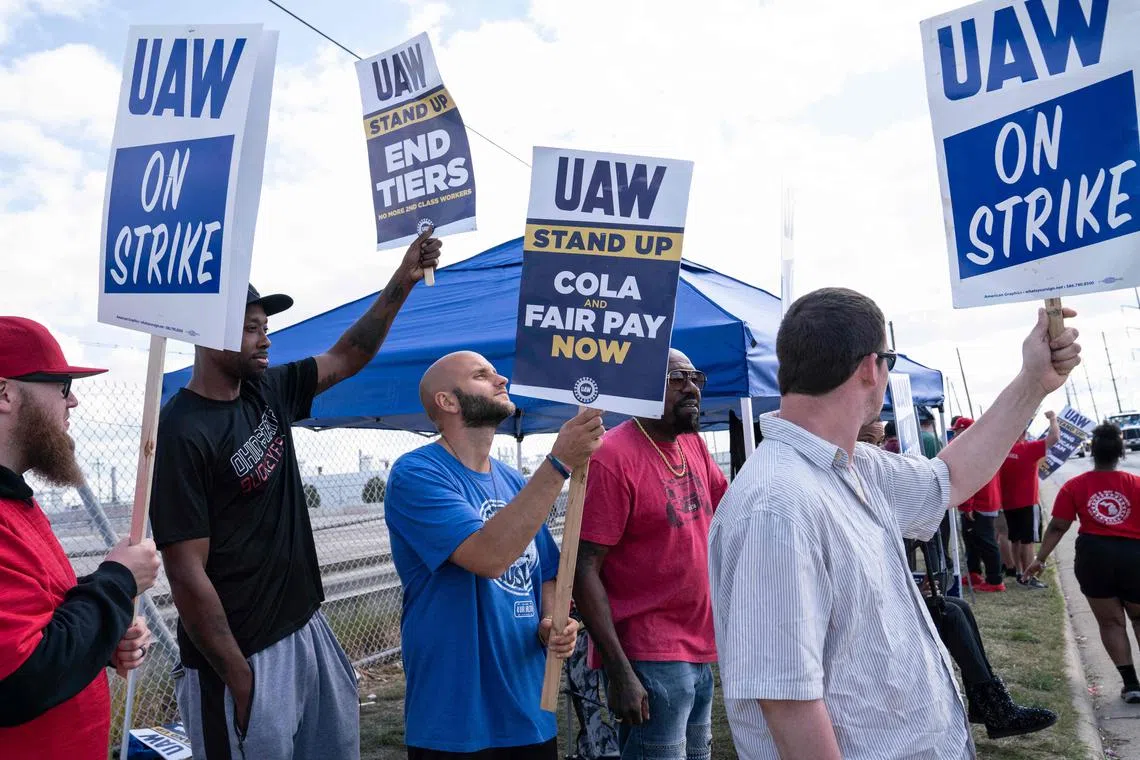 Some 12,700 workers are striking at three Detroit auto plants in one of the most ambitious US industrial labour actions in decades.