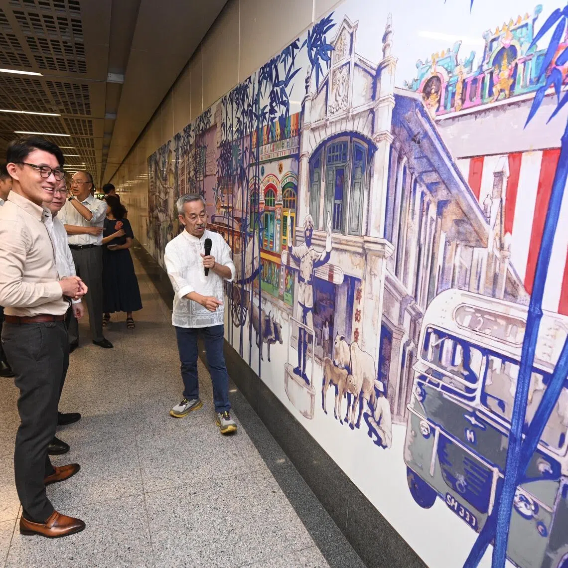 ST20251021_202534500304 Azmi Athni eslta21//

Mr Baey Yam Keng, Minister of State for Transport, and Culture, Community and Youth, looking at the commemorative artwork for Land Transport Authority?s 30th anniversary at Little India Station with artist Yeo Siak Goon on Oct 21, 2025. 

ST PHOTO: AZMI ATHNI