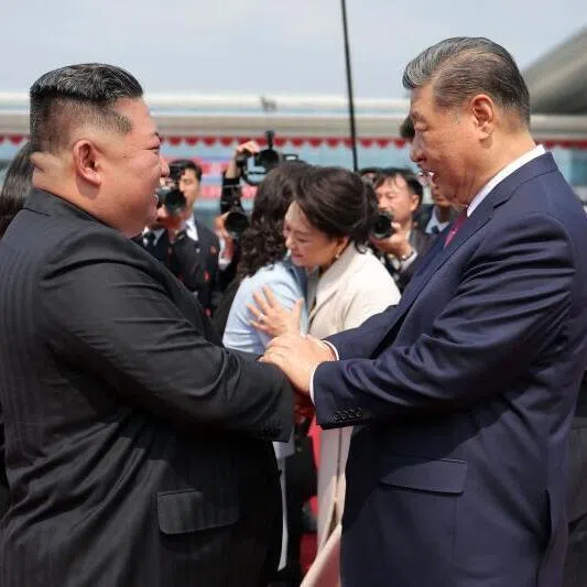 North Korean leader Kim Jong Un (L) seeing off China's President Xi Jinping after  the latter's rare visit to North Korea on June 8, where he proclaimed a willingness to bring ties to "new heights" . 