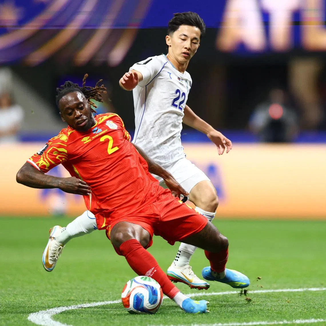 Soccer Football - FIFA World Cup 2026 - Group K - DR Congo v Uzbekistan - Atlanta Stadium, Atlanta, Georgia, U.S. - June 27, 2026 DR Congo's Aaron Wan Bissaka in action with Uzbekistan's Abbosbek Fayzullaev REUTERS/Claudia Greco
