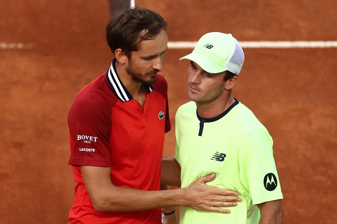 Russia's Daniil Medvedev congratulates Tommy Paul of the US after losing their round of 16 match.