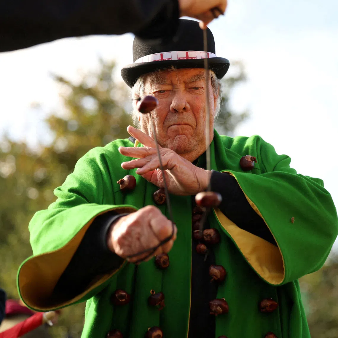 FILE PHOTO: David Jakins, known as 'King Conker', takes part in the annual World Conker Championships in Southwick, Britain, October 13, 2024. REUTERS/Phil Noble/File Photo